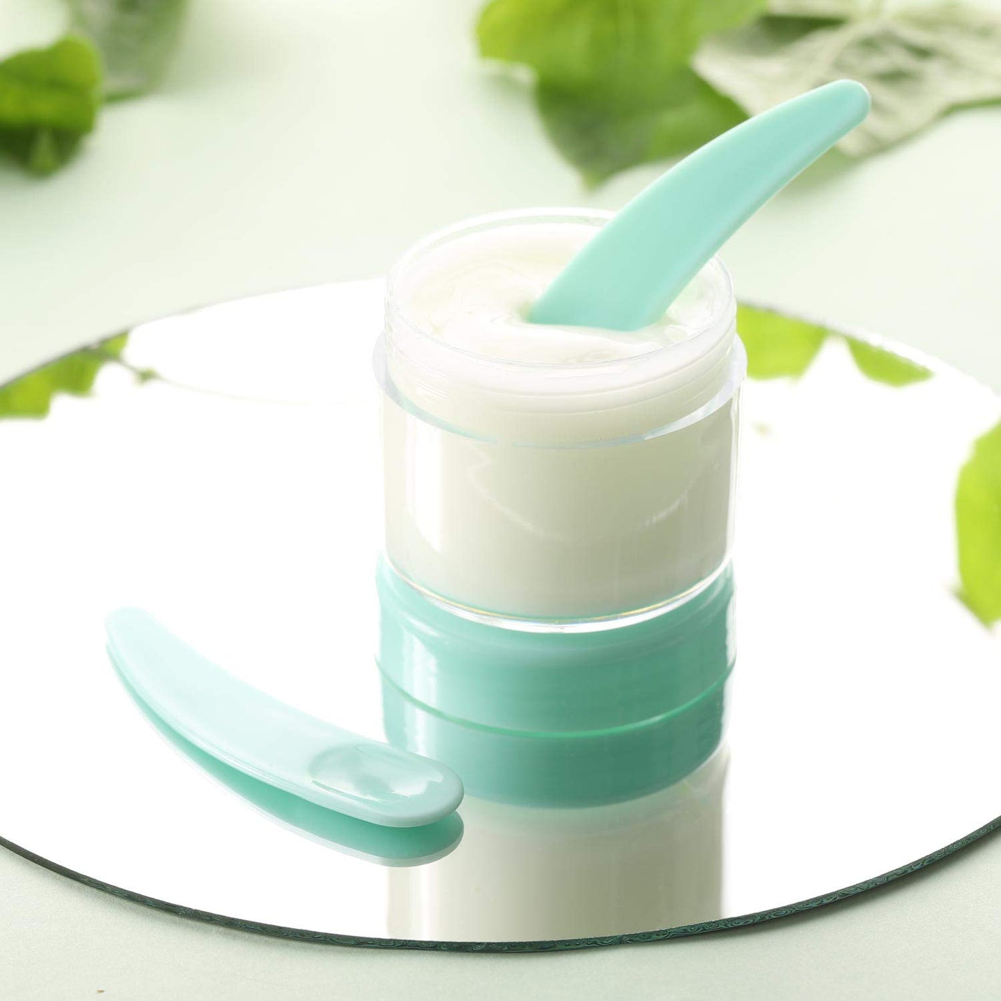 Refillable Cosmetic Sample Jars - 100 Pack 20g (0.7oz) Green Small Travel Containers with Lids + 10 Mini Makeup Spatulas - BPA Free